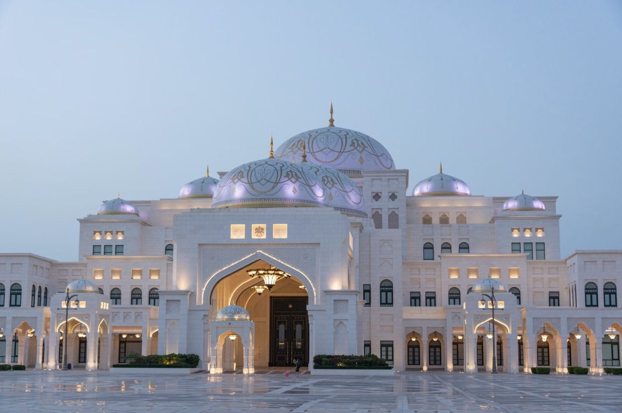 The lit domes of Qasr Al Watan palace, Abu Dhabi, at dusk